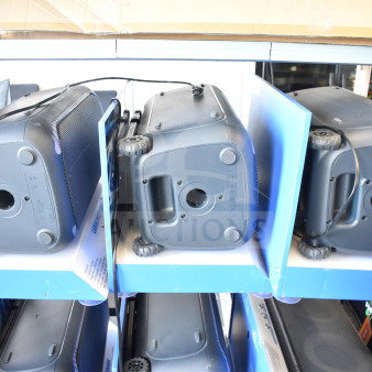 3 Onn large party speakers in store display, showcasing durable design with wheels and handle; new condition.