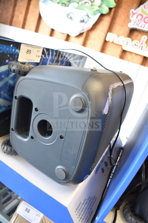 Onn Large Party Speaker display, Bluetooth, 120W power, remote, multi-color LED lights, in used condition. Auction tag reads "89".