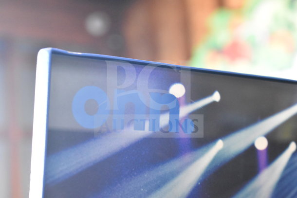 Onn store display featuring a large party speaker with vibrant lighting graphics. Brand name "Onn" prominently shown.