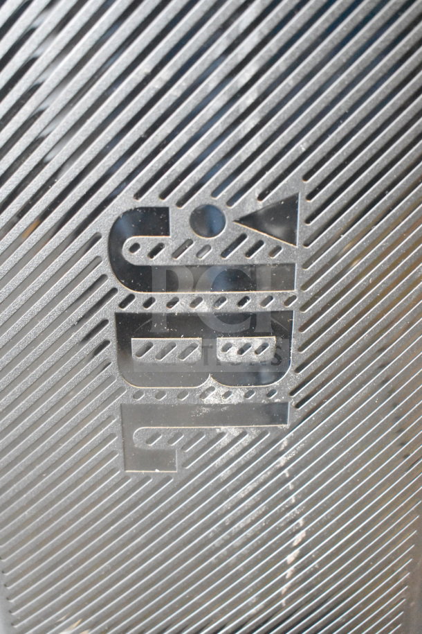 JBL logo etched on metal grille of a store display featuring JBL PartyBox310 Speaker. Vertical striped design.