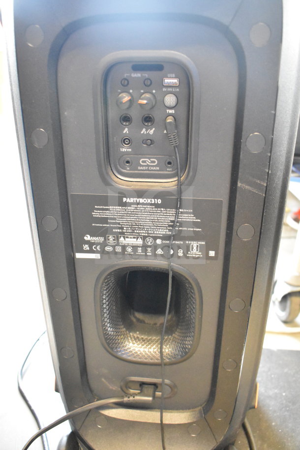 JBL PartyBox310 Speaker, rear view showing control panel with gain, USB port, and daisy chain options. Store display item.