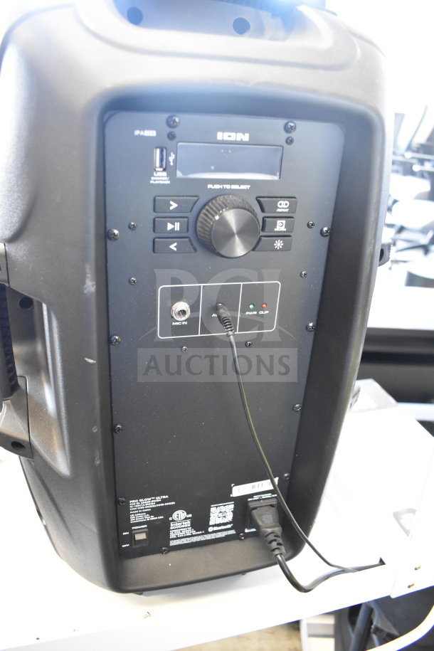 Ion Pro Glow Ultra speaker on store display, showing control panel with USB, volume knob, and mic input. Good condition.