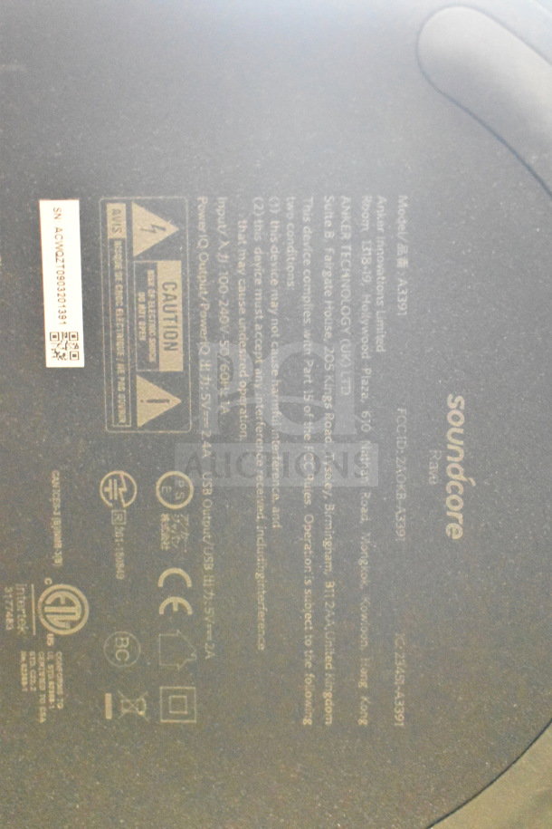 Soundcore Rave+ speaker label showing model number A3391, FCC ID, caution symbols, and compliance certifications.