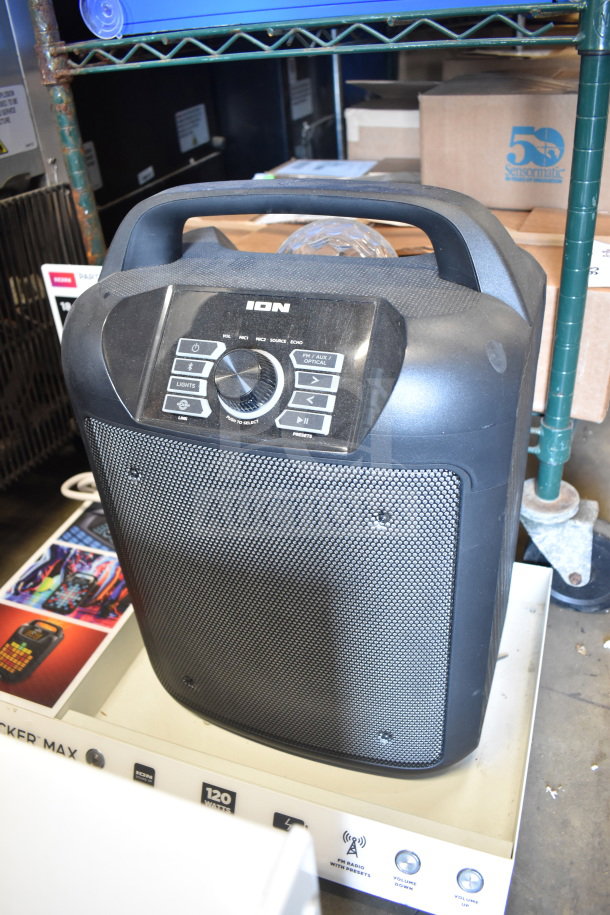Ion speaker with control panel, including volume and source buttons. Display model in good condition, part of store display set.