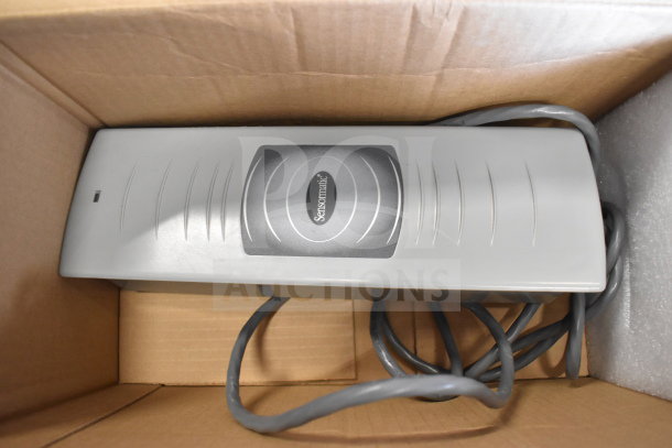 Sensormatic ZBSMPCPEF in box, gray with logo, cable attached. Part of 8-item auction. Good condition.