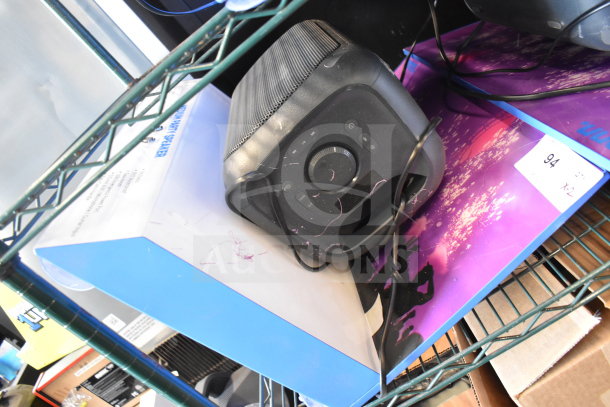 Onn Medium Party Speaker, black, in used condition with visible wear. Includes packaging. Auction tag indicates "2X your bid."