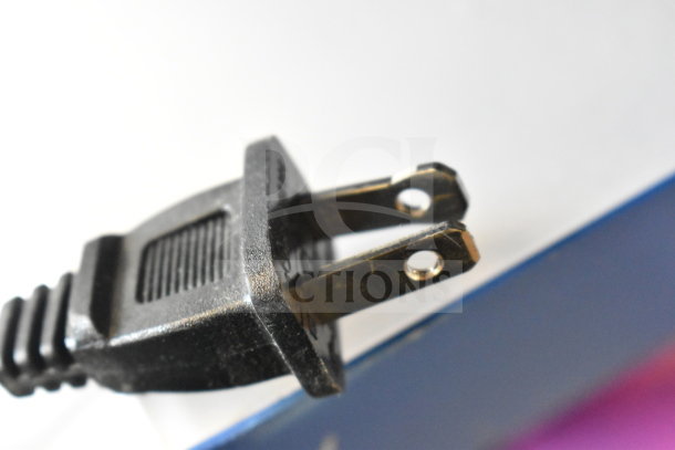 Close-up of a two-prong plug of an Onn Large Party Speaker. Black plastic body, clean condition.