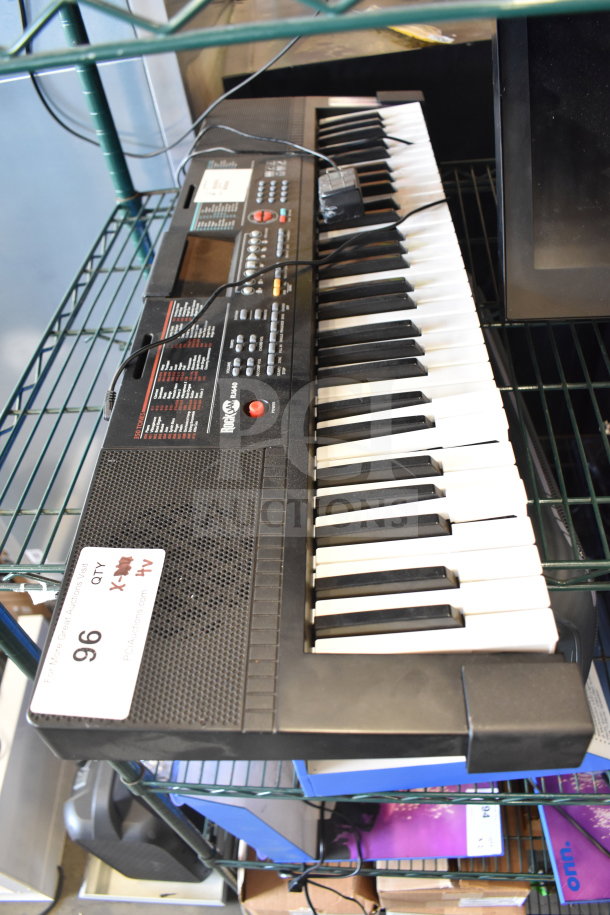 Keyboard with Yamaha branding, partial view. Auction tag reads "Lot 96". Includes electronic controls and display.