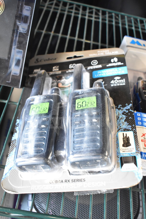 Cobra RX Series walkie talkies in packaging, featuring 40-mile range and rugged design. Includes charger.