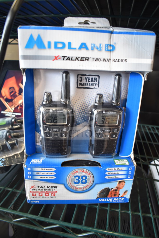 Midland X-Talker two-way radios, new in box, 36 channels, 38-mile range, 3-year warranty tag visible.