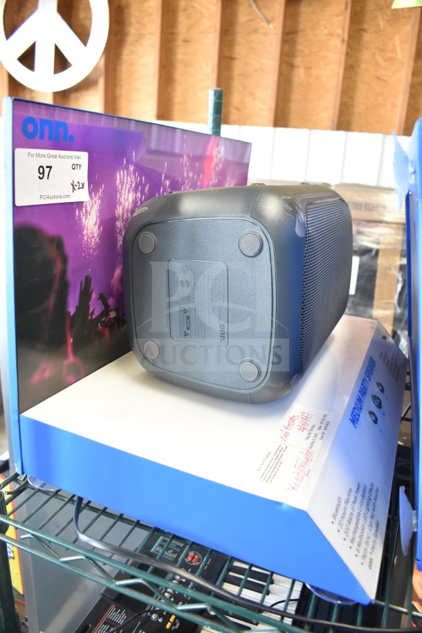 Onn large party speaker on store display shelf, showing model label and price tag.
