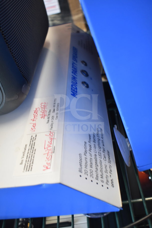 Onn large party speaker display box, featuring Bluetooth, 20-hour playtime, 200 watts, LED lighting effects, in used condition.