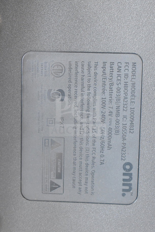"Onn Large Party Speaker label. Model: 100094812, FCC ID: HBOPA2322, 4000mAh battery, input: 100-240V, IPX7 rating."