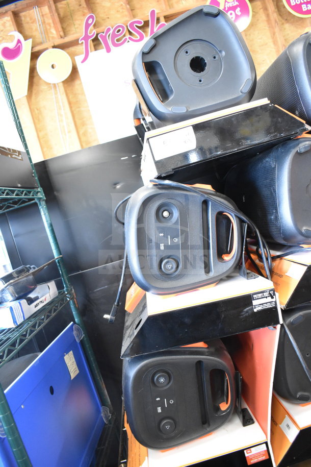 3 JBL speakers in store display, stacked vertically. Each has visible controls and ports. Good condition.