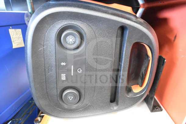 JBL speaker faceplate with controls for Bluetooth, bass boost, and power. Used condition, part of a store display set.
