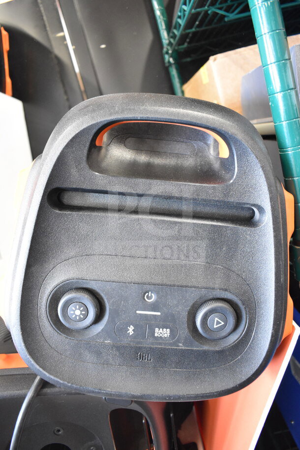 JBL speaker with handle, featuring power, light, Bluetooth, and bass boost controls. Slight wear, ideal for display.