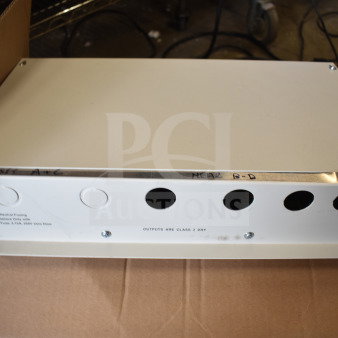 Sensormatic AMS-9060 Surveillance Controller, white, rectangular, metal casing, labeled "OUTPUTS ARE CLASS 2 DRY".