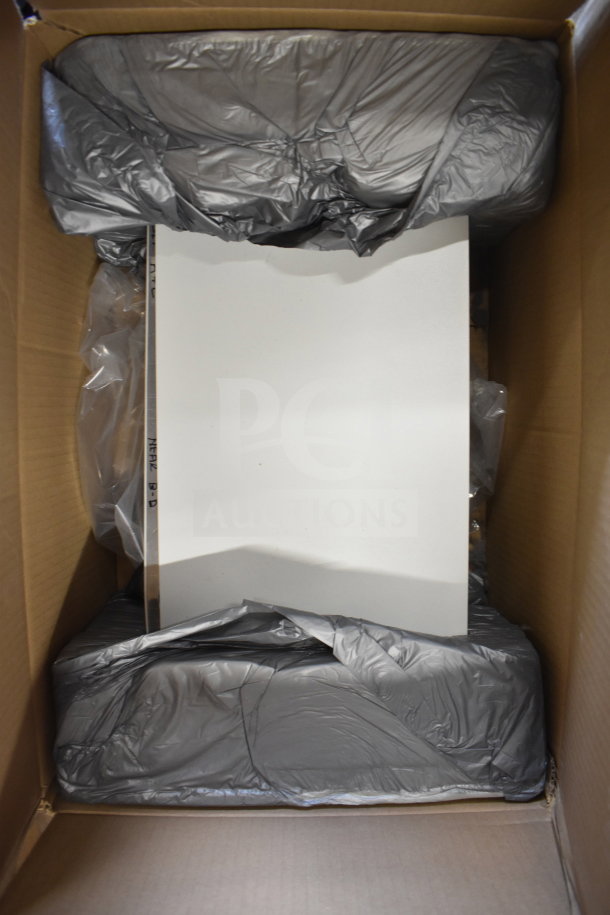 Sensormatic AMS-9060 Surveillance Controller in a box, new condition, packed with protective materials, model visible on side.