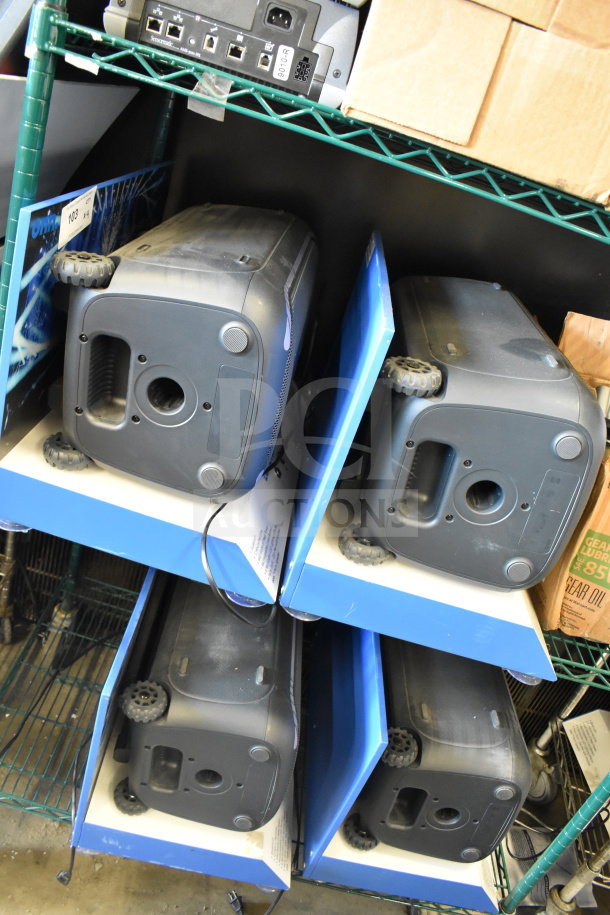 Four Onn speakers used in store displays, black with visible ports, on metal shelves. Condition appears used.