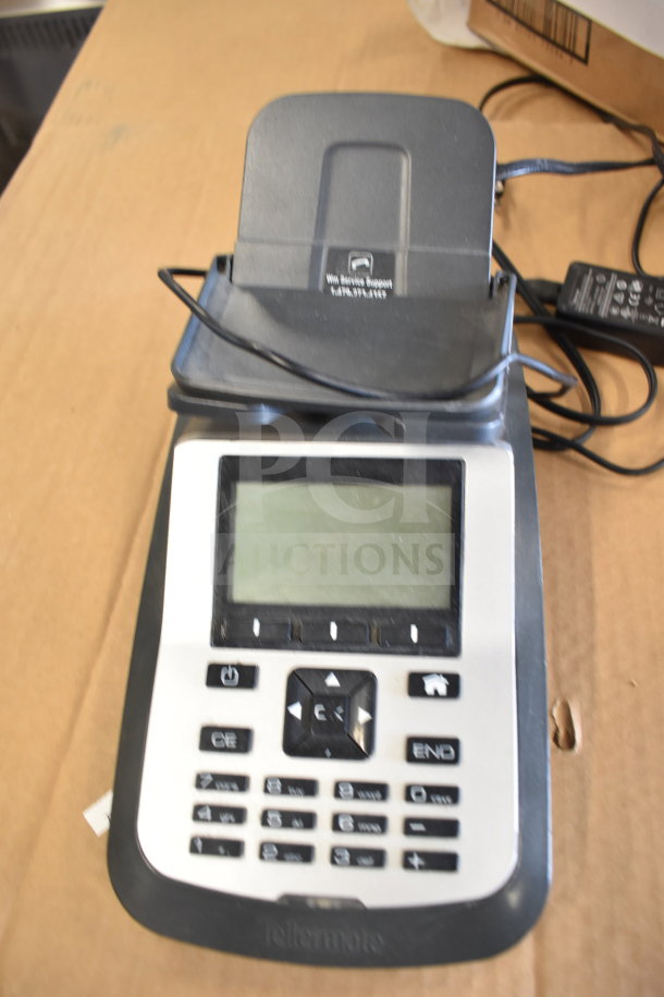 Tellermate calculator with digital display and numeric keypad, in used condition. Includes power cord and visible support label.