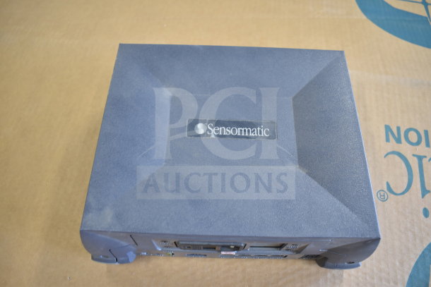 Sensormatic ZBSMPROE device, black, showing top logo. Condition appears used. Part of a lot with 7 different items.