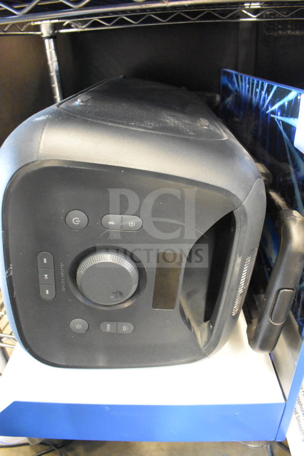 Samsung speaker display, featuring control buttons and dial. Slightly worn condition, part of 3 store displays set.
