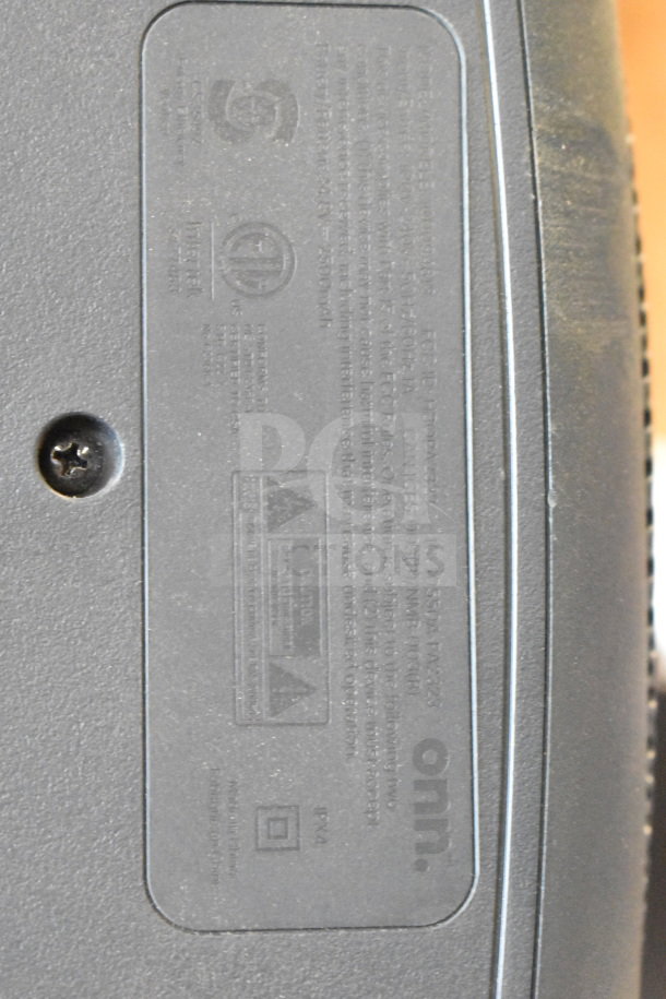 Label close-up on an Onn large party speaker display, showing model details and certification marks.