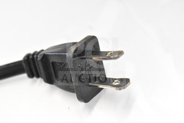 Power plug of Onn Medium Party Speaker, black with visible prongs and markings, part of store display auction.