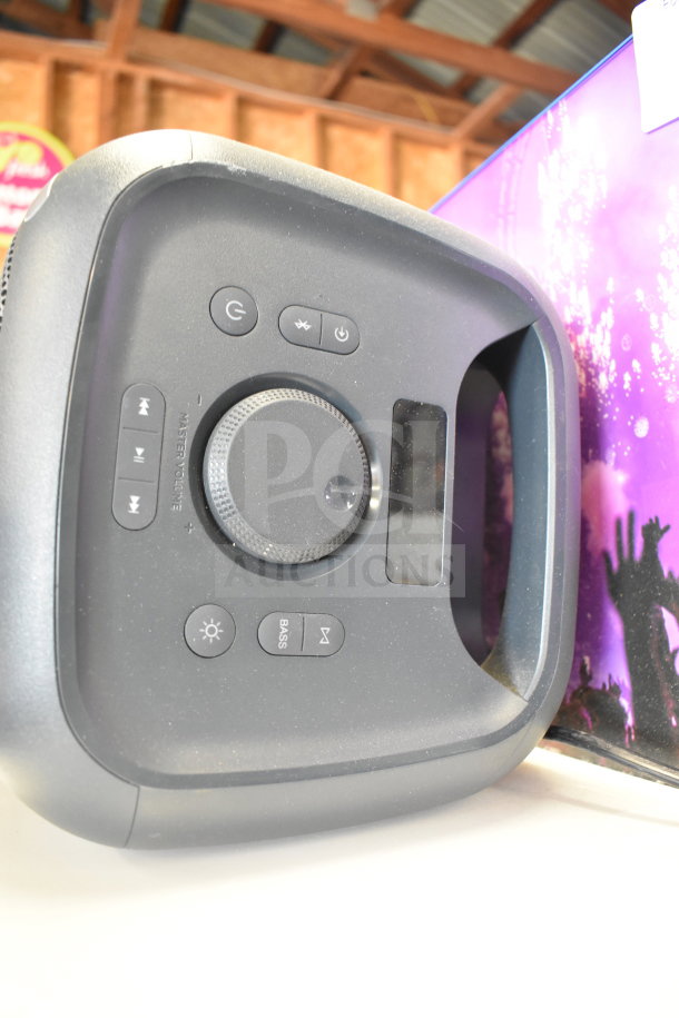 Onn medium party speaker with control panel, including volume dial and playback buttons, in good condition.