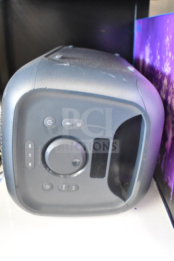 Onn Medium Party Speaker display, featuring control buttons and knob, in lightly used condition.