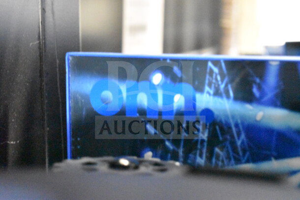 Onn large party speaker store display, featuring a close-up of the Onn logo in blue.