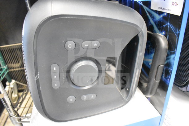 Onn large party speaker display, black with control panel, handle, and power buttons. Shows new condition.
