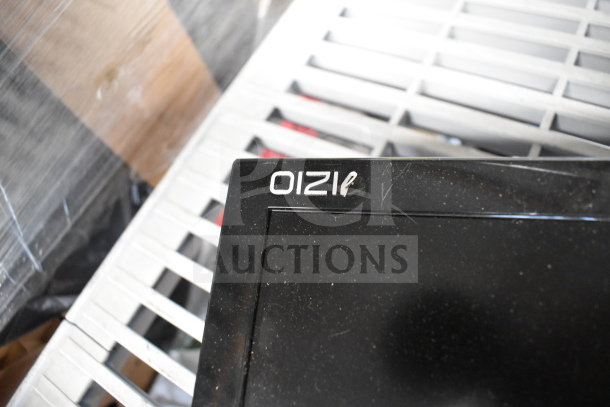 Close-up of a Vizio monitor's bezel with some scratches, part of a lot of 5 monitors including brands like Onn, MSi, and Samsung.