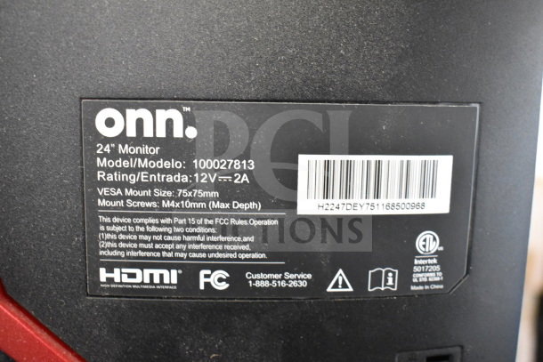 Label on Onn 24" Monitor model 100027813, 12V-2A rating, VESA 75x75mm mount, HDMI, FCC compliant.