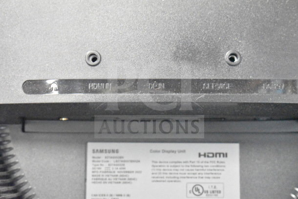Close-up image of a Samsung monitor's rear panel, showing HDMI input and service port labels. Model: S27A650D.