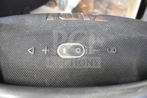 Black JBL Boombox 3 speaker on display with control buttons visible, featuring Bluetooth connectivity and power indicators.