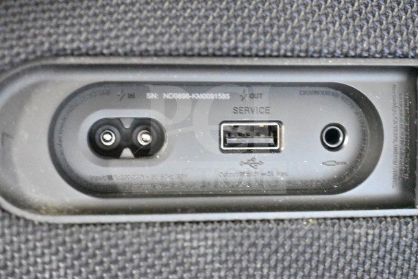 Close-up of JBL Boombox 3 speaker rear panel, showing input ports, service USB port, and fabric covering. Serial number visible.