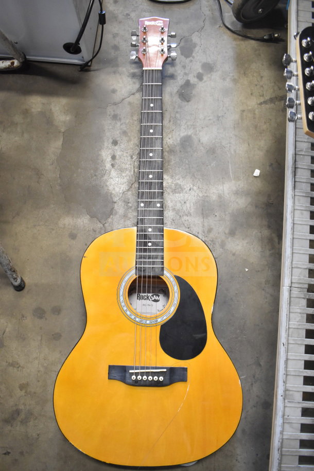 Rock Jam acoustic guitar, model AG-IN-36, natural wood finish, six strings, visible small scratch on body, sale includes 3 items.