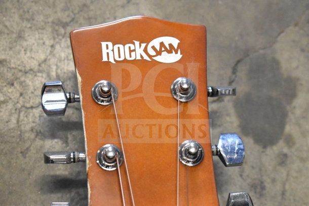 Rock Jam guitar headstock with chrome tuners; visible logo; good condition; part of a three-item auction set.