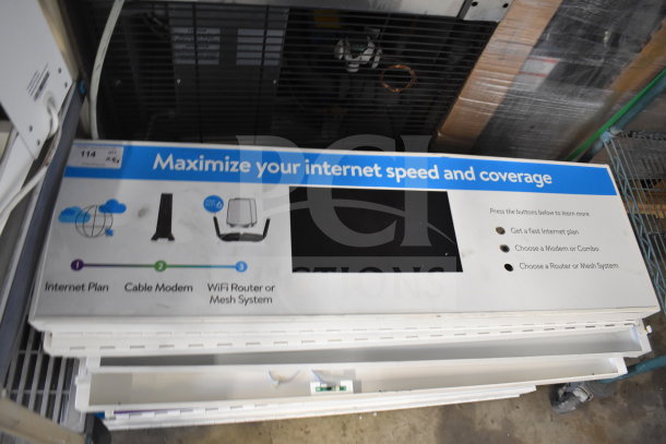 Auction item display for 8 WiFi System Boxes. Sign reads "Maximize your internet speed and coverage" with options for routers and modems.