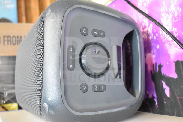 Onn medium party speaker with control buttons, volume dial, and bass adjustment, shown in excellent condition.