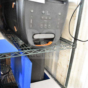 JBL PartyBox310 speaker on metal shelf, black with orange accents, control panel visible, auction tag marked "116 X-2y."