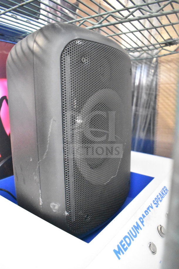 JBL PartyBox310 Speaker in medium size, black, with visible scratches and signs of wear, enhancing audio experience.