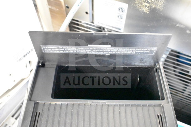 BRAND NEW Nuova Simonelli OSCAR II AD espresso machine, scratch and dent condition, 110-120V, 1 phase. Warning label visible.