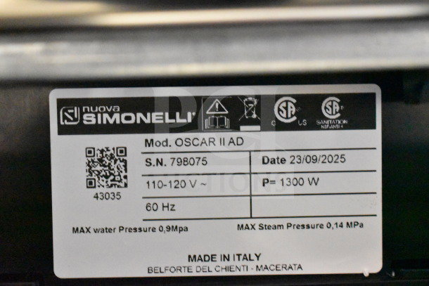 Label on Nuova Simonelli OSCAR II AD espresso machine. Indicates serial number 798075, 110-120V, 1300W, made in Italy.
