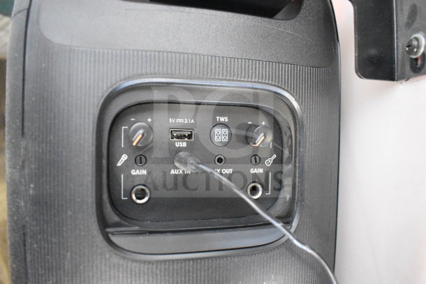 JBL PartyBox 110 speaker control panel with USB, AUX input/output, gain knobs, and TWS button visible.