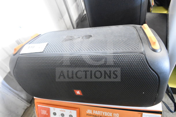 JBL PartyBox 110 Speaker on store display. Black with orange accents, model label visible. Two times your bid offer.