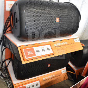 Store display with JBL PartyBox 110 speakers. Features include Bluetooth connectivity, dynamic light show. Excellent condition.