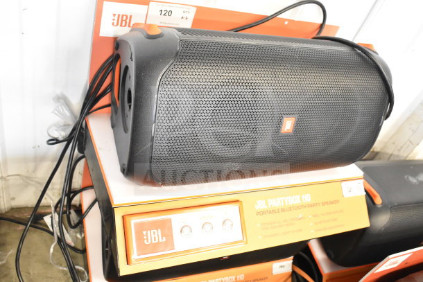 JBL PartyBox 110 Speaker on display with original packaging, showcasing control panel and branding.