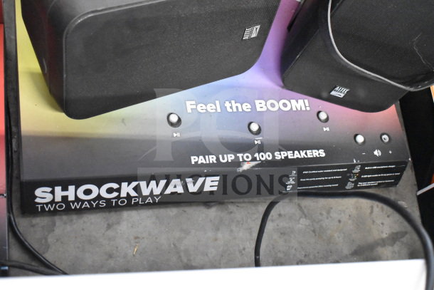 Altec Lansing Shockwave speaker display, pairs up to 100 speakers. Includes "Feel the BOOM!" branding.